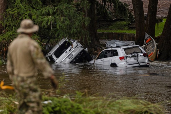 Vehicles can be seen submerged and destroyed during the destruction caused by the flood.